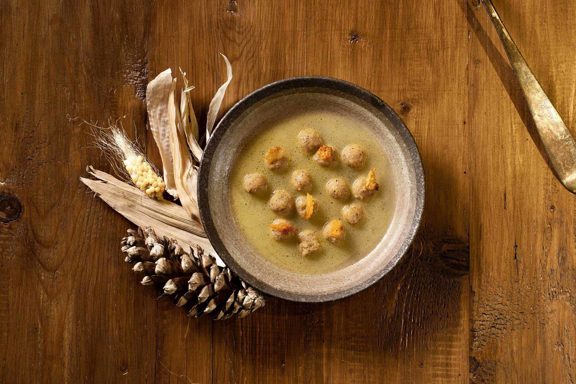 Polenta taragna pearls in a Raclette broth.